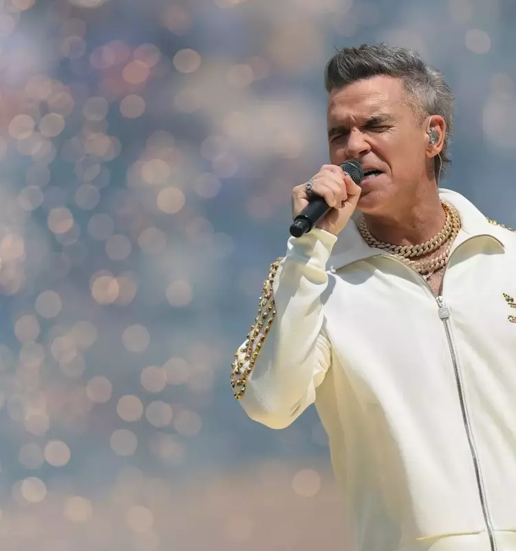 Robbie Williams Unveils 'Spies' Ahead of Britpop Album Launch