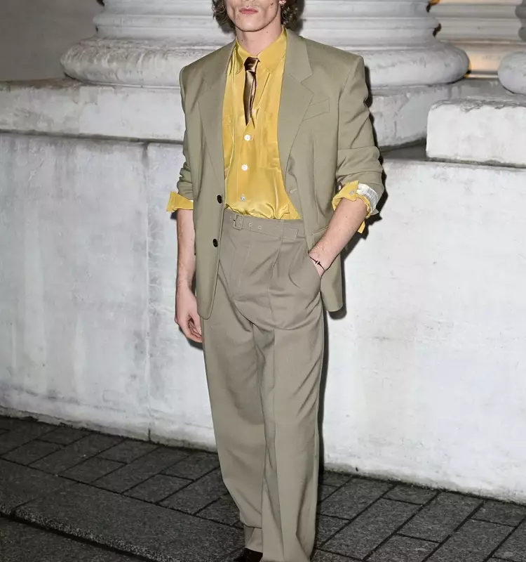 Connor Storrie's Style Evolution: Embracing the Statement Bag for SNL Debut